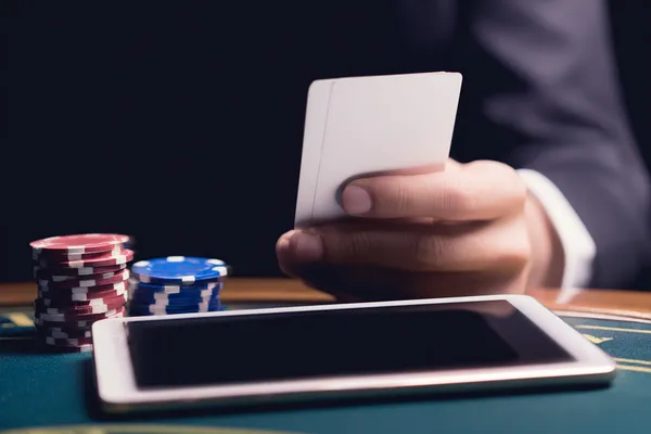 A confident dealer surrounded by casino chips inviting players to access their JL777 account, reflecting quick and easy login options.