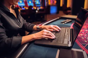 A laptop glowing with a bright login prompt in a minimalistic setup, symbolizing the protected access system at JL777.